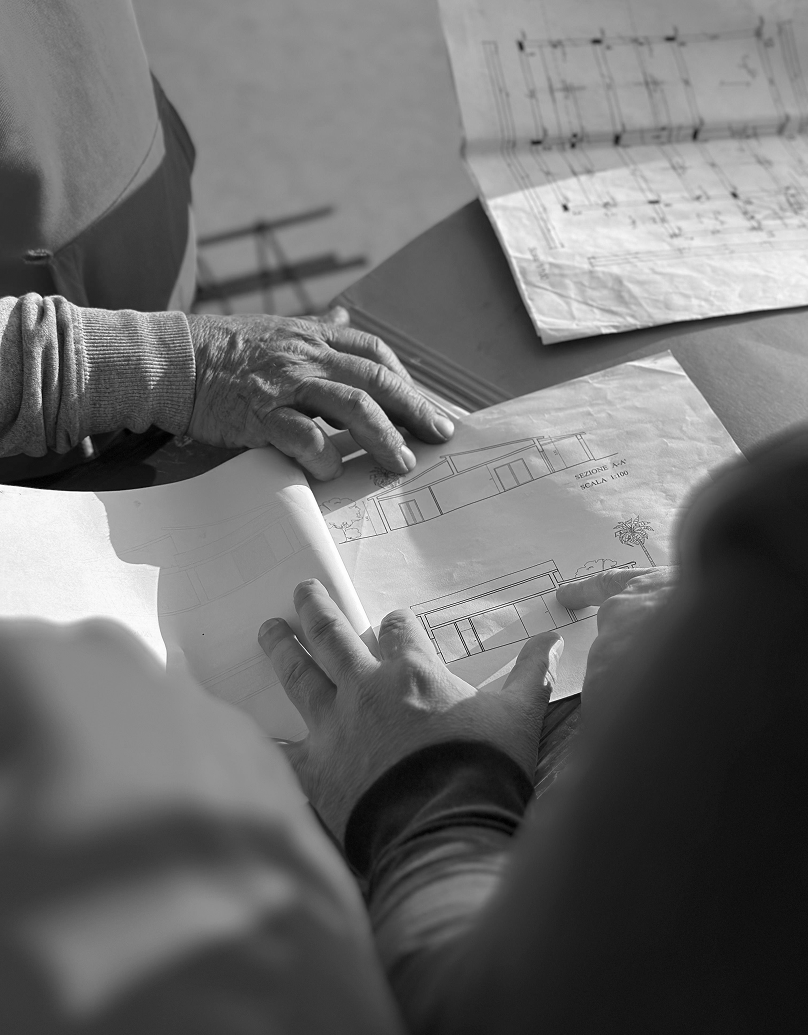 Construction team reviewing architectural plans